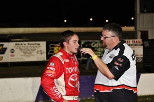 Christopher Bell (left) is interviewed by series announcer Dewain Hulett after finishing second, Friday. Bell has two seconds and a win in three starts with the series this season in the Fox 53 machine.